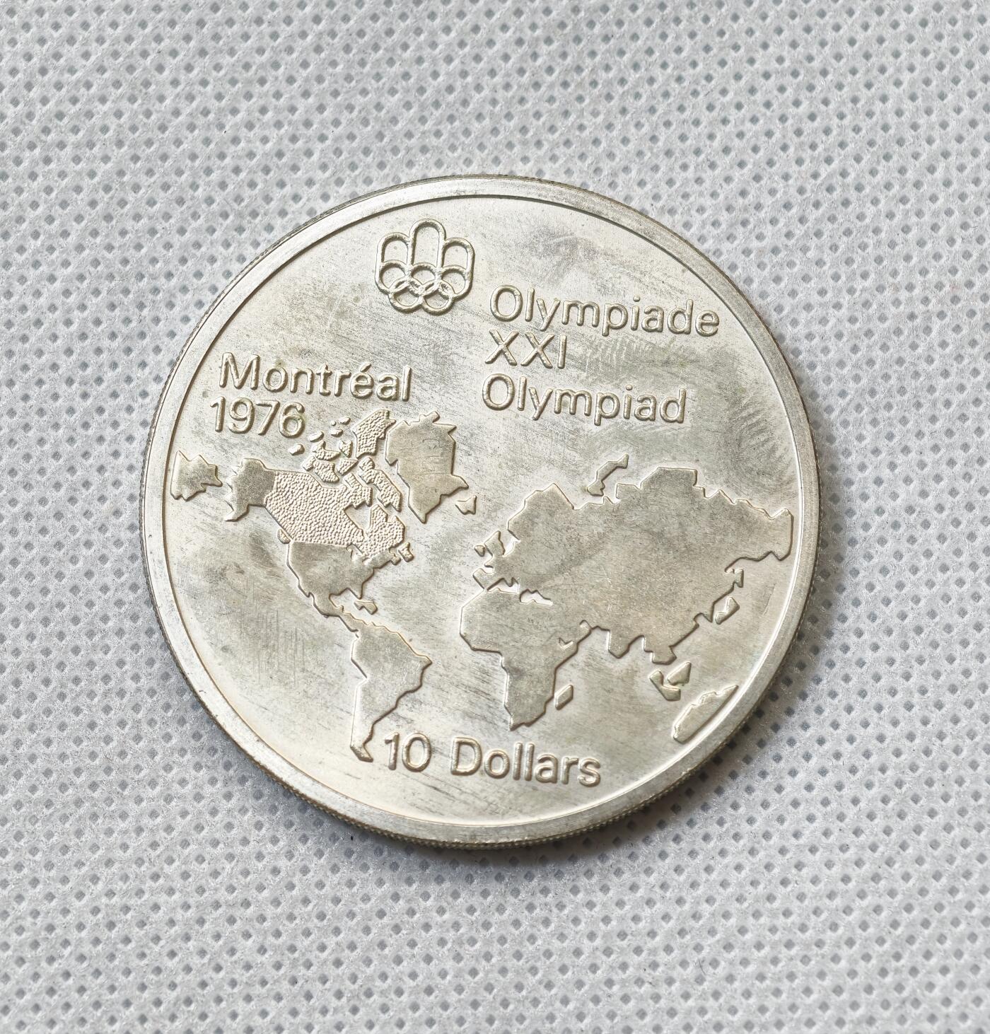 甄臻铺-世界币章拍卖（第55期），3月28日甄品场（直播拍卖）拍品征集中，送拍享返佣金等优惠多多 1973年加拿大奥运会10元大银币（2），48.6克925银