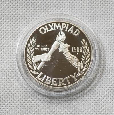 甄臻铺-世界币章拍卖（第55期），3月28日甄品场（直播拍卖）拍品征集中，送拍享返佣金等优惠多多 - 1988年美国汉城奥运会主题一美元银币