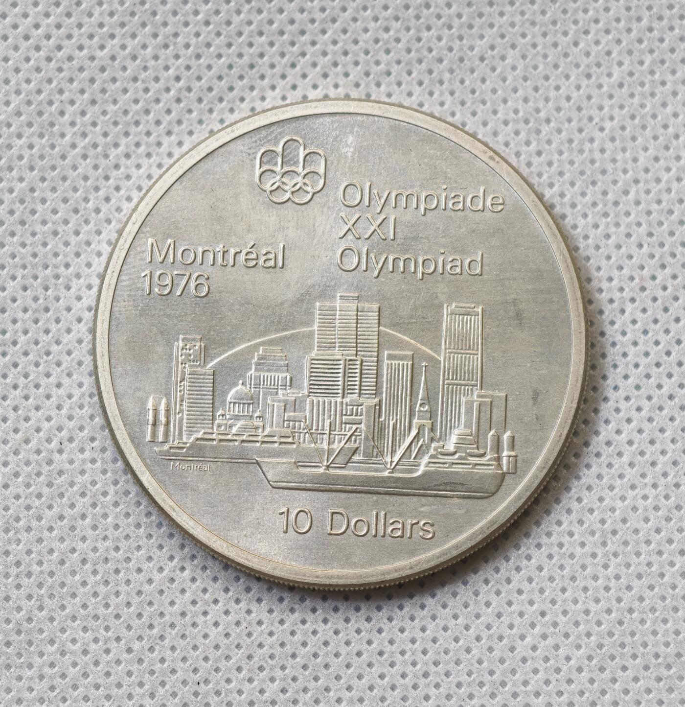 甄臻铺-世界币章拍卖（第55期），3月28日甄品场（直播拍卖）拍品征集中，送拍享返佣金等优惠多多 1973年加拿大奥运会10元大银币（1），48.6克925银