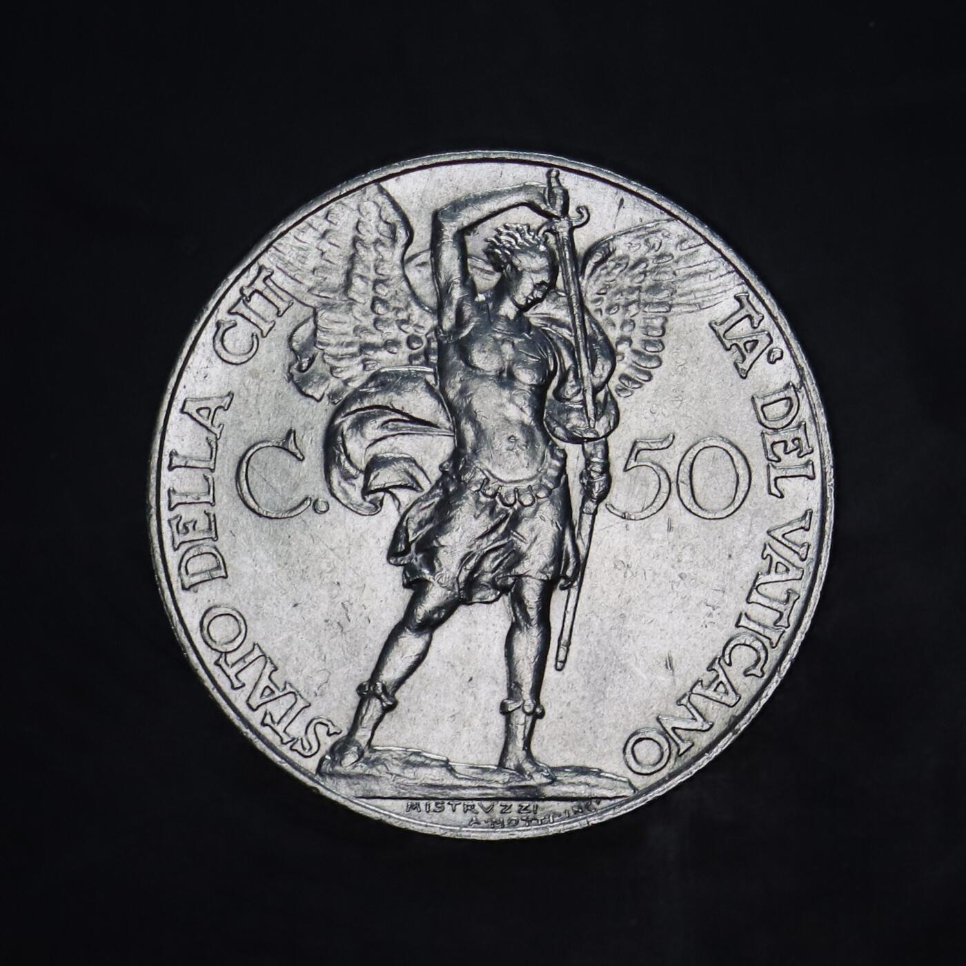 观钱 近现代机制币拍卖No.005（全场顺丰包邮，不区分偏远地区）  梵蒂冈 1936 年庇护十一世 大天使圣米迦勒 50 分镍币，最美镍币，大天使圣米迦勒（San Michele Arcangelo），身披羽翼，手持利剑与权杖，姿态英武。 由意大利著名雕刻师奥雷利奥・米斯特鲁齐（Aurelio Mistruzzi）设计，古典主义雕刻风格精湛，宗教题材富有感染力。