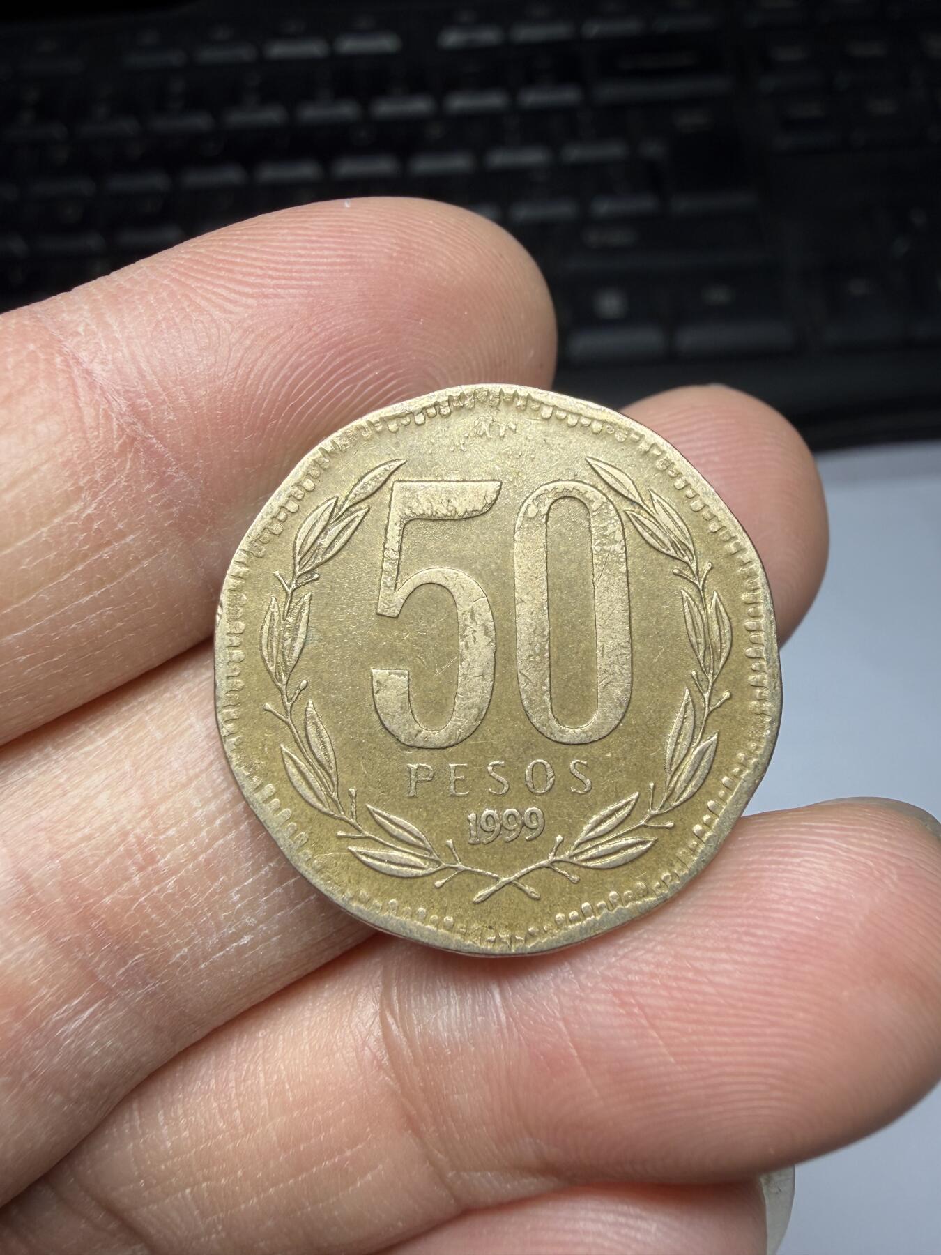 2026年集古藏今外币拍卖第三期-第6场—（总第316拍），可以寄存60天，满160元包邮。 1999年智利50比索