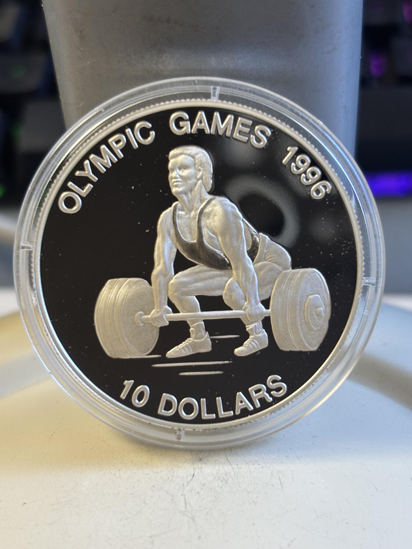 第194期拍卖 瑙鲁1995发行96年奥运会举重1盎司纪念银币，925银