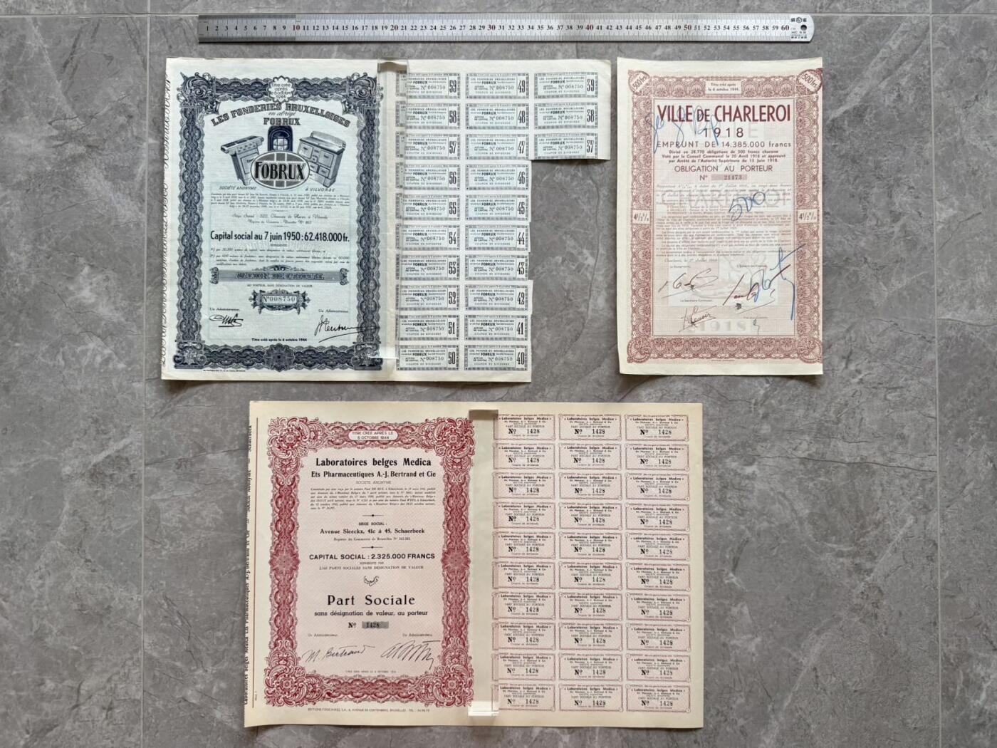 （自动截拍）PMG评级民国纸币专拍第20260324期，全场包邮 【乾奕收藏】出上世纪初欧洲国家企业股票债券12张，部分带分红息票，老股票实物难得，品相如图，老股票债券因材质保存环境等原因均存在不同程度的裂口，破损缺角，折角，虫蛀，老式贴补等瑕疵