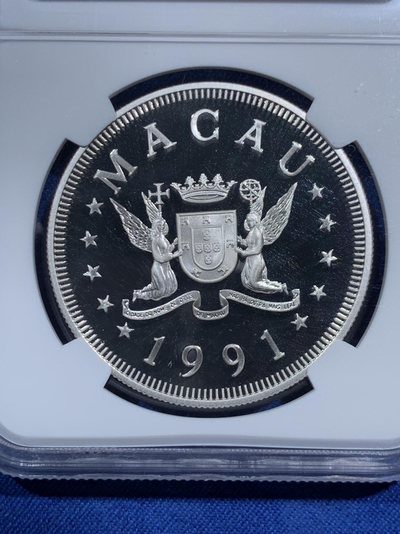 《竞宝斋》第473场 周日，周一 2场连拍 （全场包邮）欢迎送拍 NGC PF69UC 中国澳门1991年生肖羊年100元精制银币，直径38mm，重28.28g，925银，发行4000枚。PROOF精制币，币面清爽干净又舒适，状态一流。