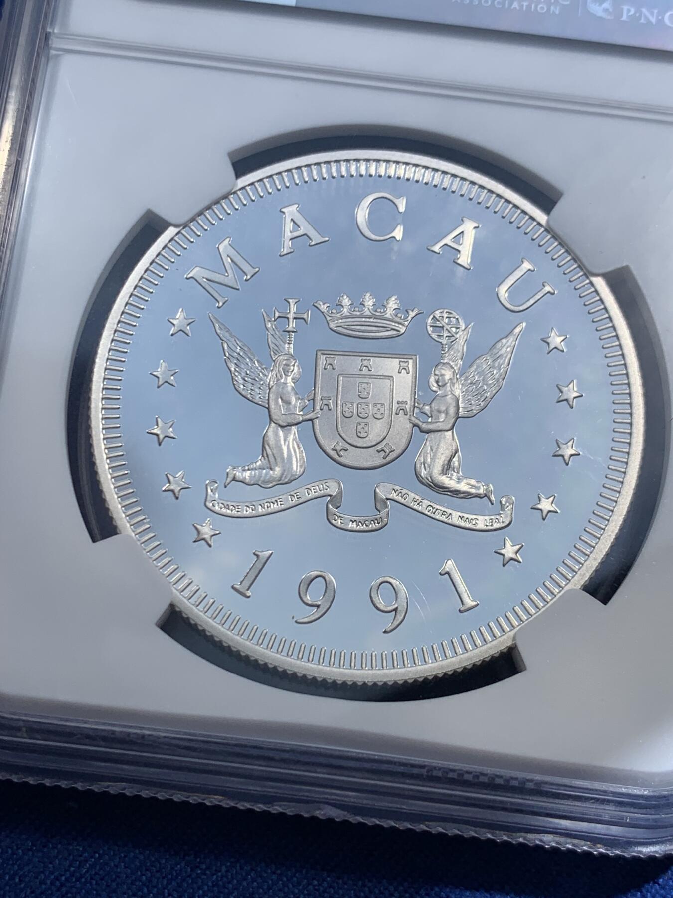 《竞宝斋》第473场 周日，周一 2场连拍 （全场包邮）欢迎送拍 NGC PF69UC 中国澳门1991年生肖羊年100元精制银币，直径38mm，重28.28g，925银，发行4000枚。PROOF精制币，币面清爽干净又舒适，状态一流。