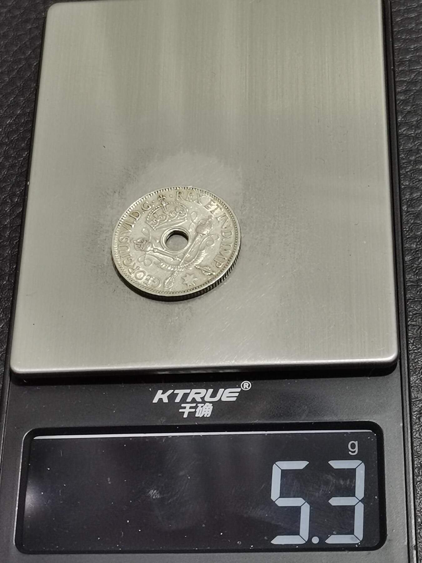 天下钱庄专场欢迎参拍 新几内亚中孔银币