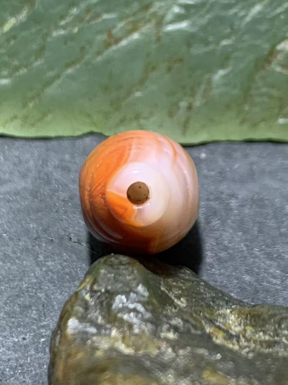 精美川料冰飘柿子红南红玛瑙一体佛头三通一个