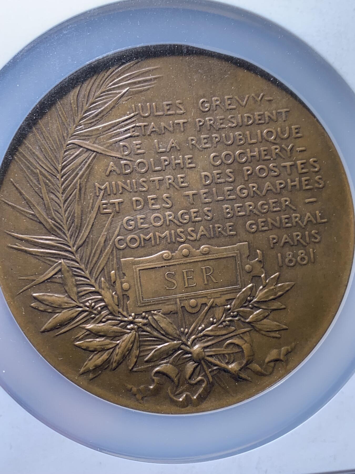 《竞宝斋》第474场 周日，周一 2场连拍 （全场包邮）欢迎送拍 NGC MS63BN 1882年法国电力展览铜章，罕见Roty大师作品，高分评级，见证工业革命电力时代，收藏意义独特。加大加厚盒