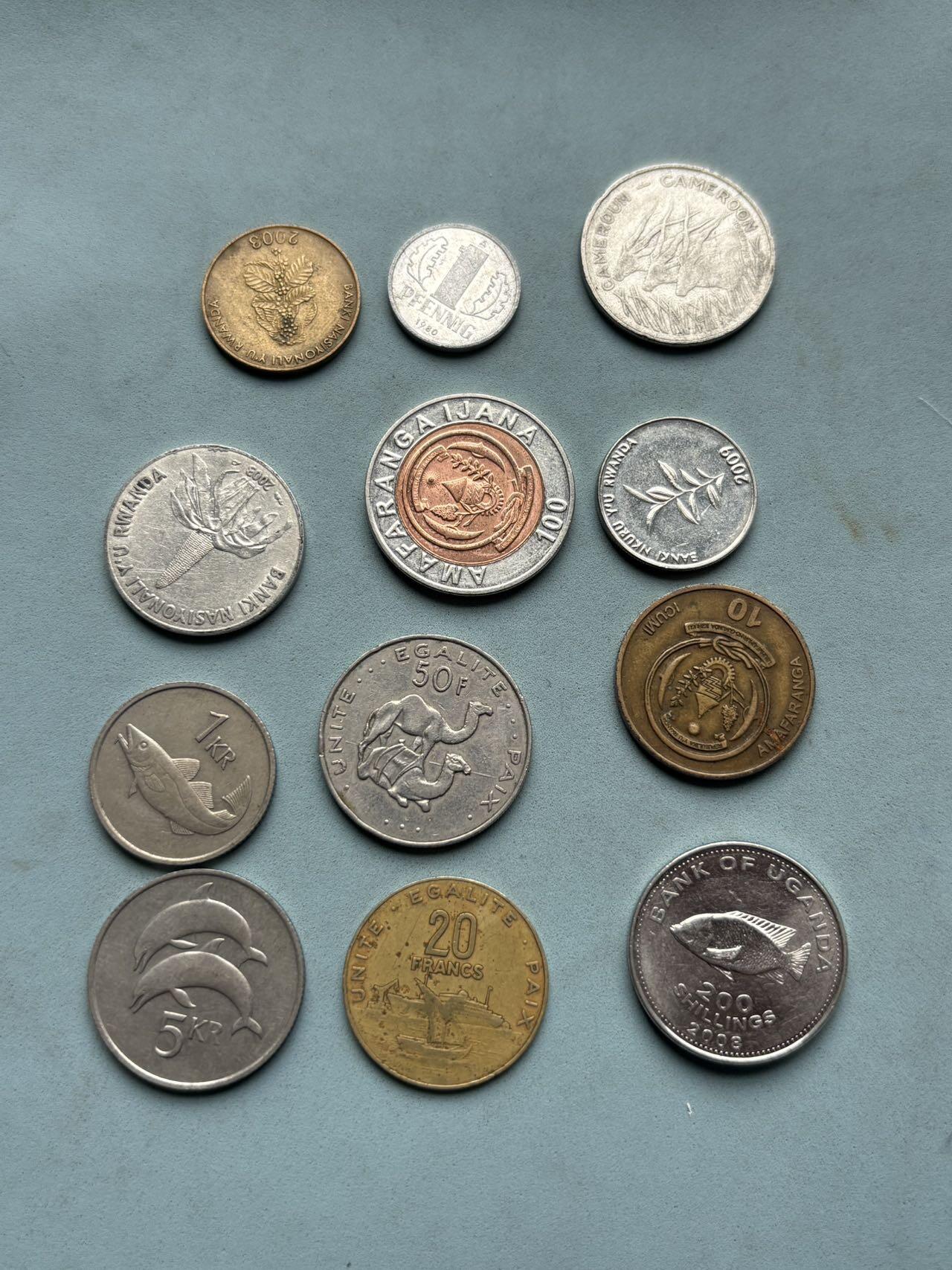 盛世勋华——号角文化勋章邮票专场拍卖第310期 非洲、欧洲多国流通硬币一组12枚，涵盖东德、冰岛、卢旺达、乌干达、安哥拉、吉布提、喀麦隆、科摩罗等国家