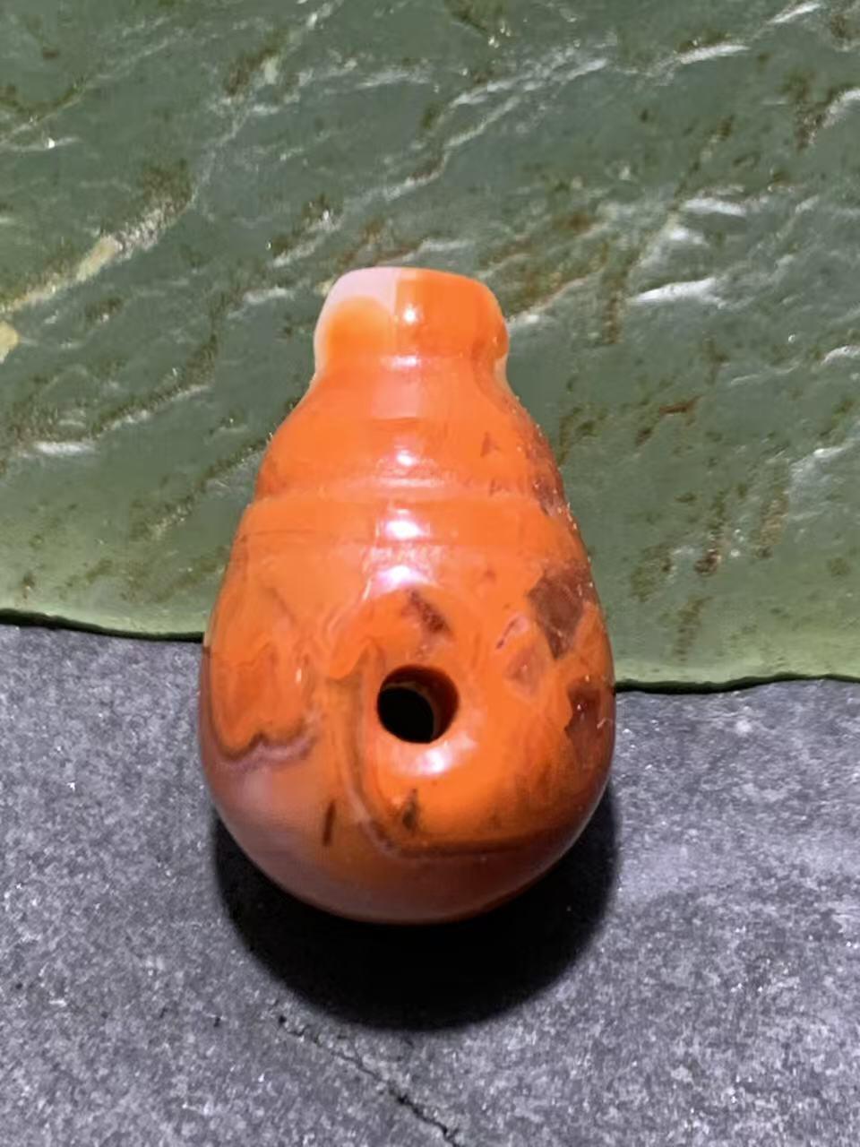 精美川料冰飘柿子红南红玛瑙一体佛头三通一个