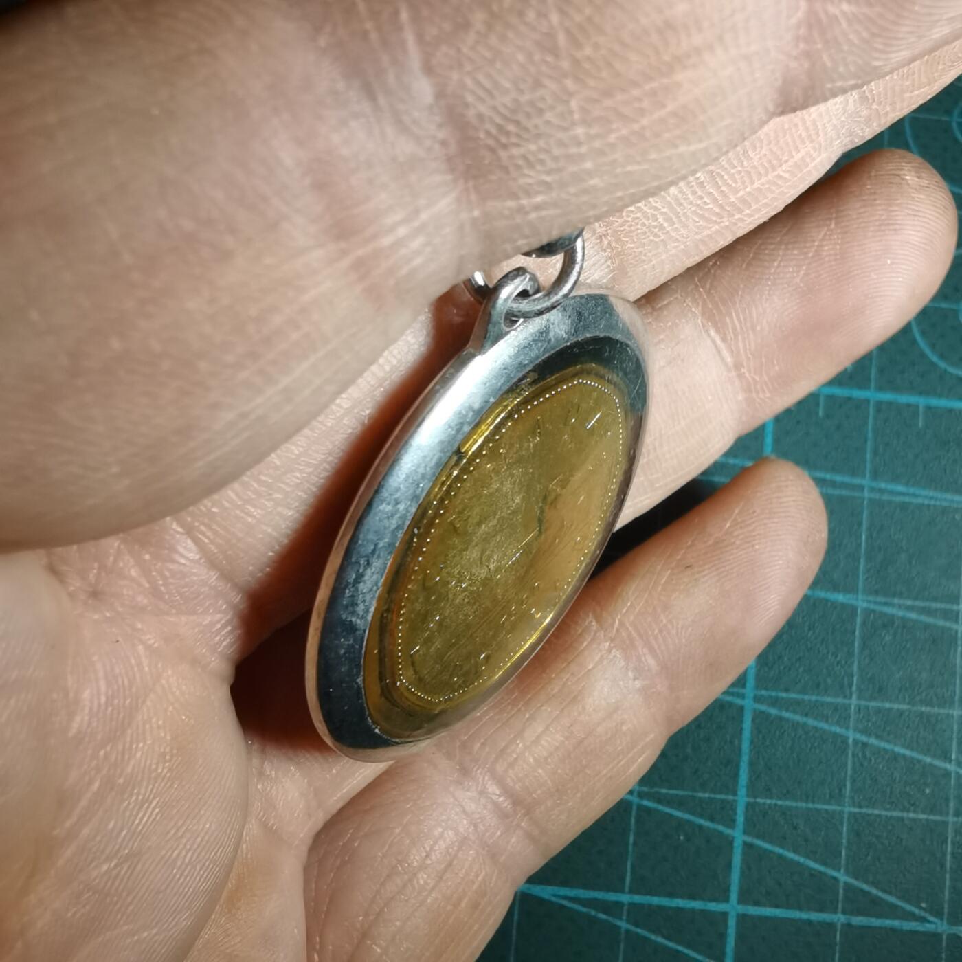 沼泽如烟--第1033场 加拿大一元吊坠