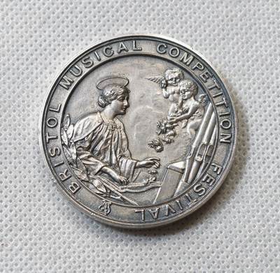 甄臻铺-世界币章拍卖（第56期），送拍享返佣金等优惠多多 - 英国Bristol 1917年音乐节银质纪念章，直径41.5毫米，重40.2克。正面“Bristol Musical Competition Festival”字样，背面花环装饰