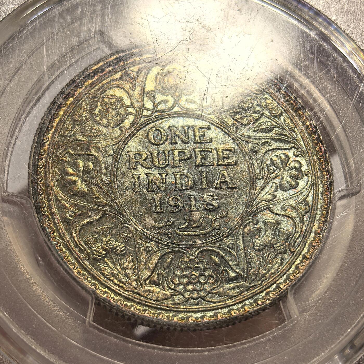 博洋堂“芳菲春韵”3月精品大拍专场暨第166期（全场包邮） PCGS MS65 英属印度1918年B版乔五1卢比银币，打制深，包浆熟，正面五彩，似《灵魂战车》中恶灵骑士，背面金黄蓝色包浆均匀非常漂亮，乔五卢比上MS65分以上非常少，这枚为PCGS亚军分，上面仅2枚65+更高分，同分22年10月拍出4873元，相比之下，这枚彩更好，为收藏精品。