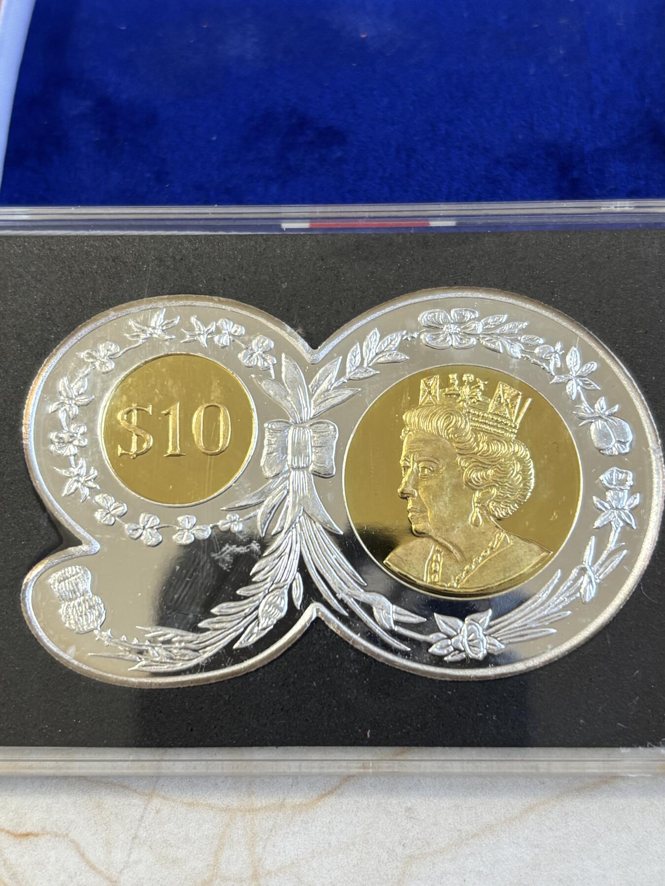 第195期拍卖 维尔京2016年英女王90大寿90数字形镀金2盎司银币，999银，发行3000枚