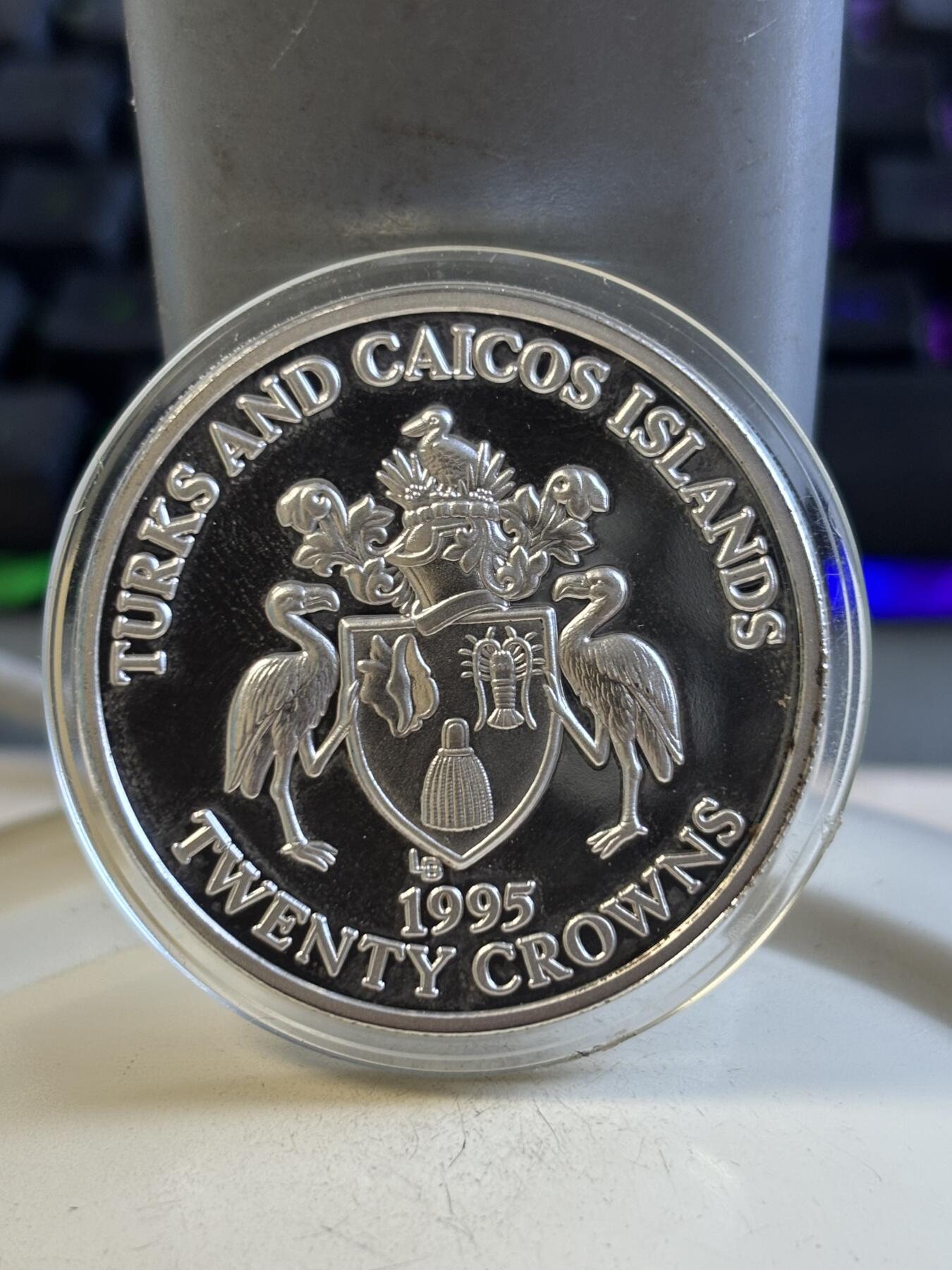 第195期拍卖 特克斯和凯科斯1995年战争结束50周年纪念银币，999银，1盎司