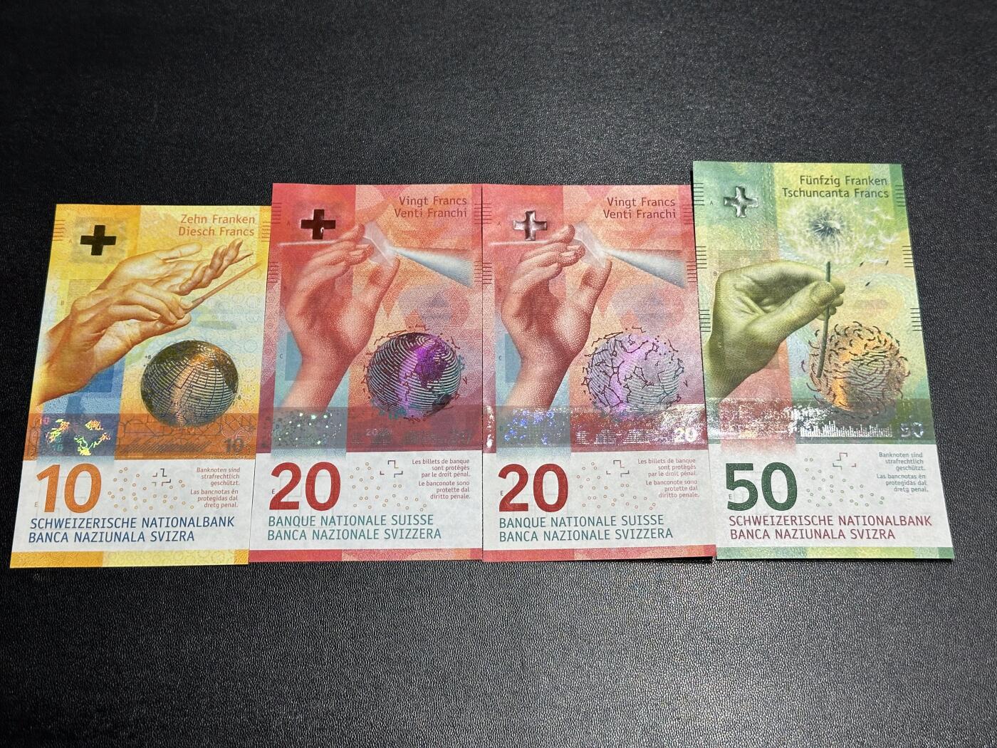 《外钞收藏家》第六百二十一期（精选场）（长期征集拍品、欢迎藏友们联系合作） 瑞士手版10-50法郎（20法郎有两张） 四张一起 全新UNC
