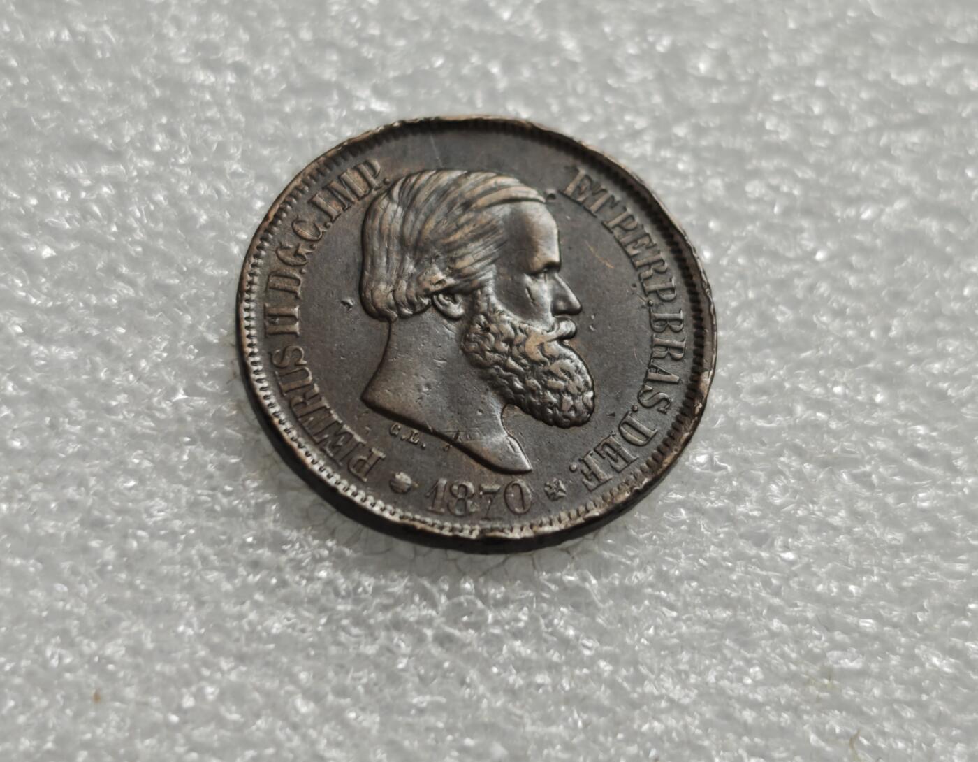 瓶子🏺第234期拍卖会  巴西帝国佩德罗二世20瑞斯铜币（1870年）   巴西帝国时期（1822–1889）佩德罗二世（Pedro II）统治下发行的20 Reis（瑞斯）铜币，铸造年份为1870年 拉丁文 PETRUS II D. G. C. IMP. ET PERP. BRAS. DEF.，意为“佩德罗二世，蒙神之恩，巴西皇帝及永久捍卫者” 