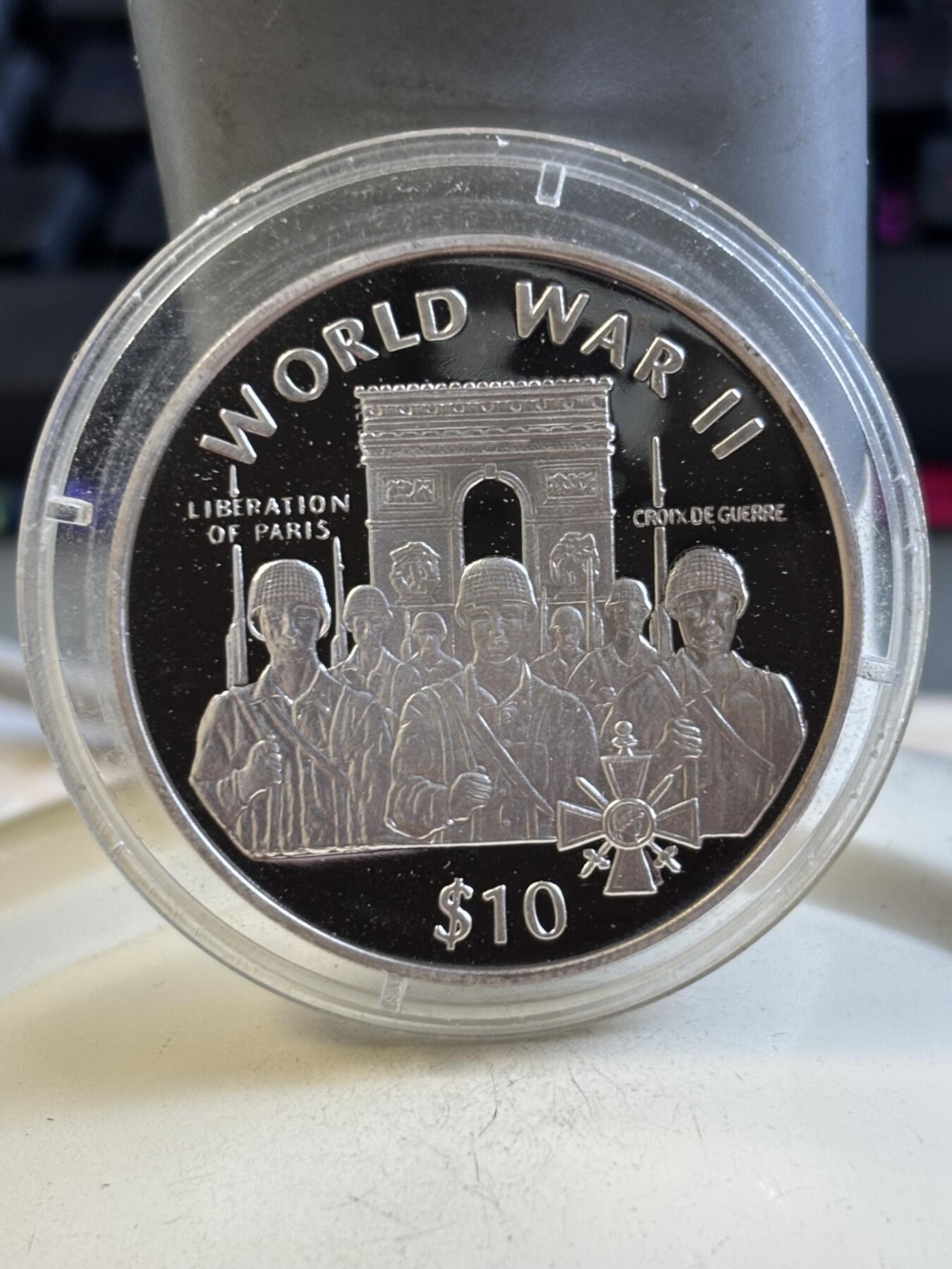 第195期拍卖 利比里亚1997年世界第二次大战纪念银币，925银，31克，有氧化点