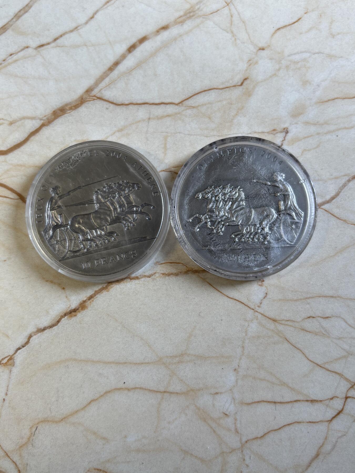 第195期拍卖 刚果加纳2001年古代太阳神马车凹凸银币两枚，999银，31.1克*2，发行15000套