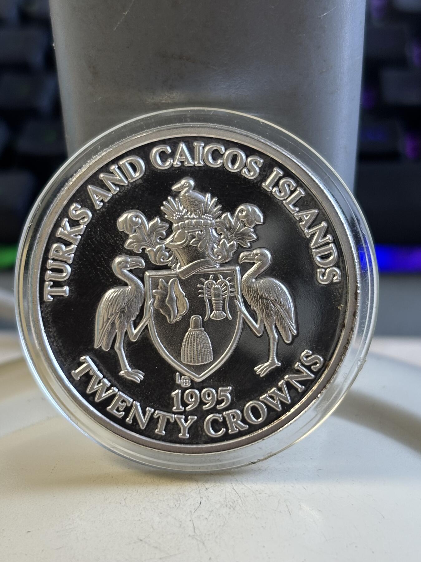 第195期拍卖 特克斯和凯科斯1995年战争结束50周年纪念银币，999银，1盎司