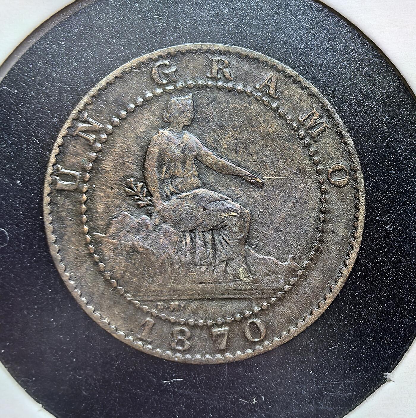 外国优质老铜币银币苏联纪念章，每周六晚九点倒数截拍，满百包邮可寄存，持续收拍 少见西班牙 1870 年 1 分铜币，正面坐像女神手持橄榄枝，背面雄狮持盾国徽，百年铜色包浆厚重，细节清晰，是伊比利亚近代钱币收藏的历史佳品。