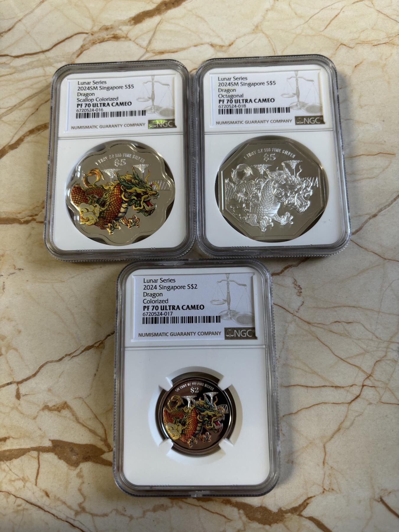 第194期拍卖 新加坡2024年十二生肖龙年银币3枚套NGC-PF70，1盎司/1盎司/1/4盎司，999银，发行2000套，无盒证