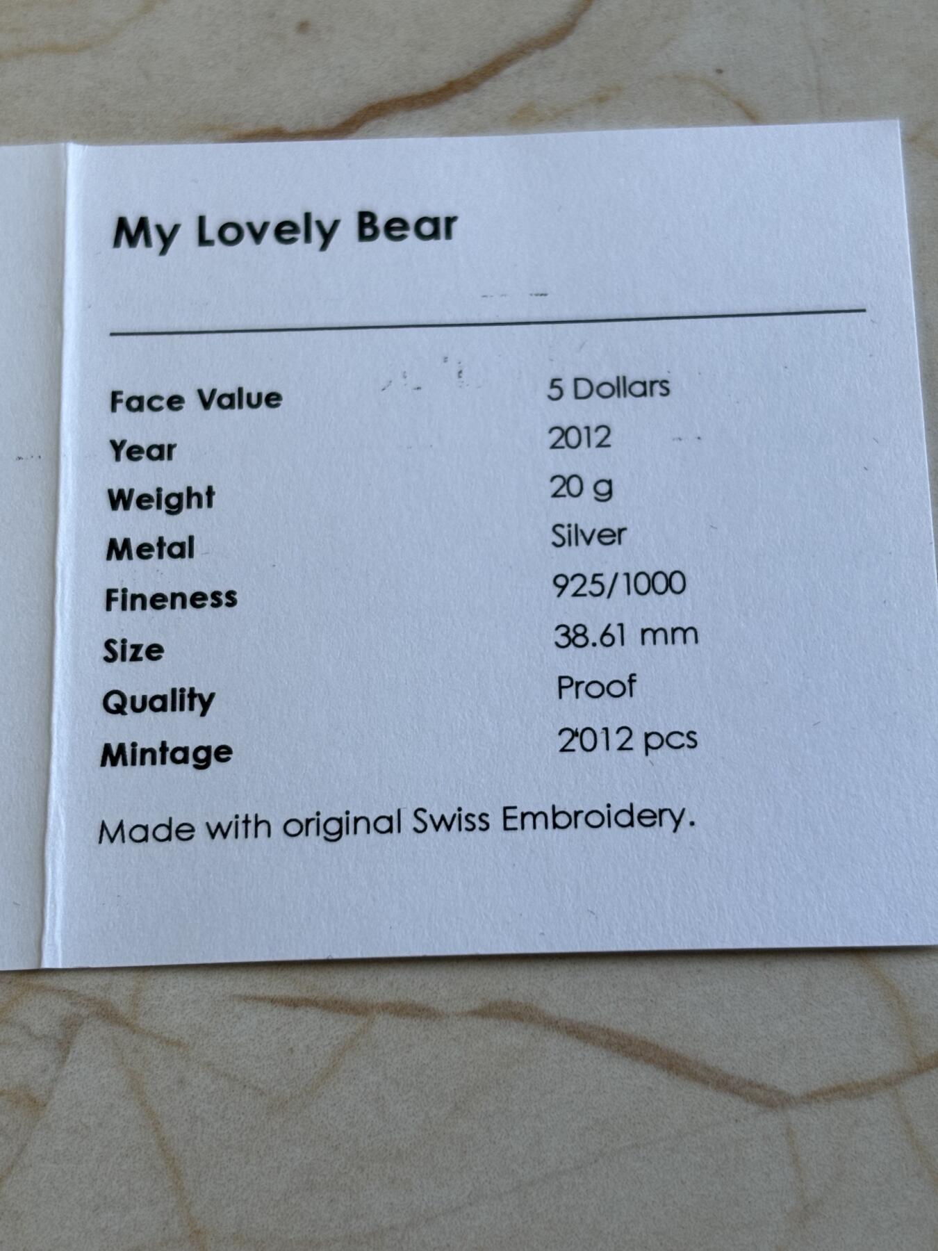 第194期拍卖 帕劳2012年（瑞士刺绣）幸福的小熊精制银币带证书，925银，20克 ，发行2012枚，有氧化