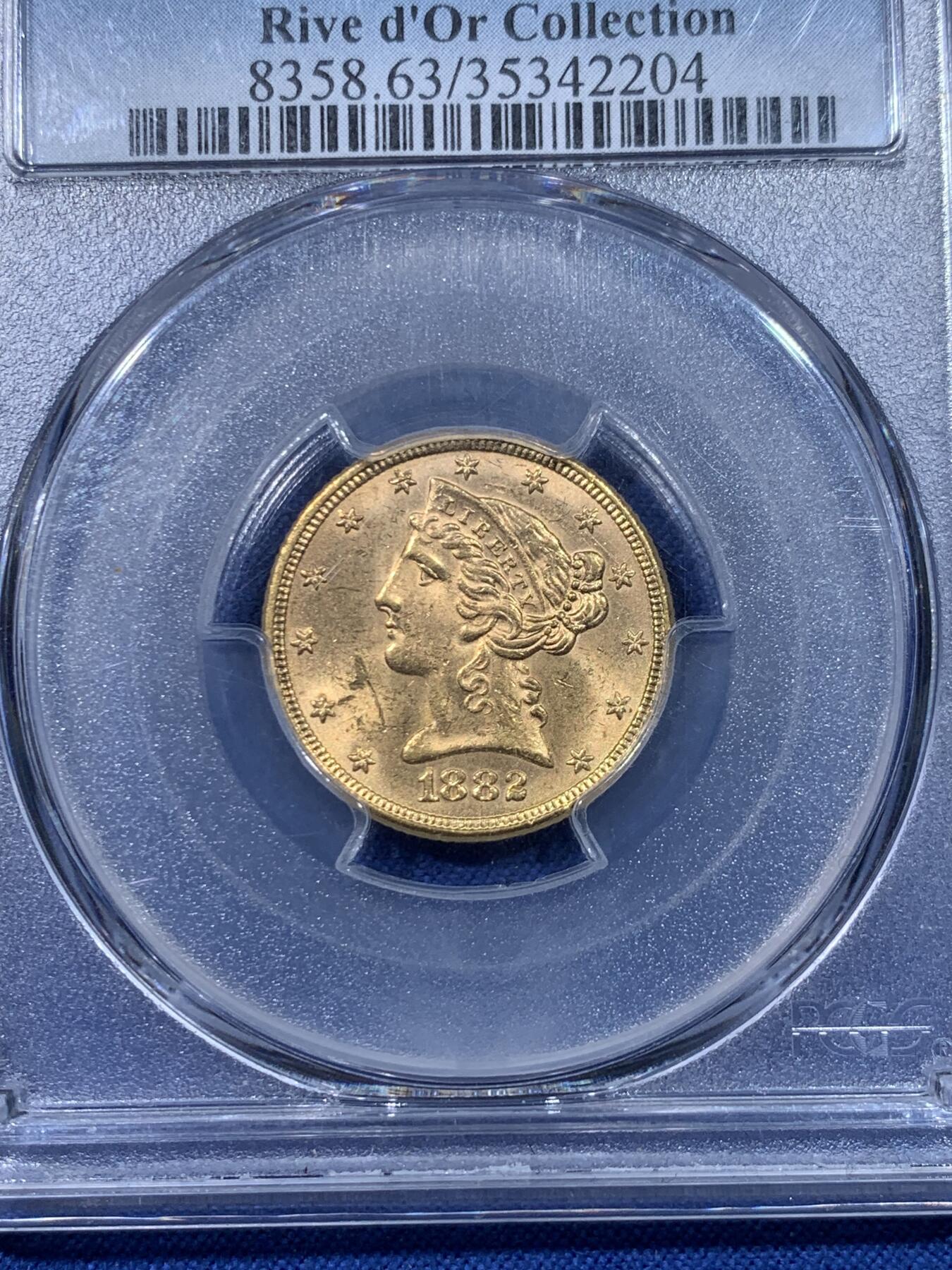 《竞宝斋》第475场 周日，周一 2场连拍 （全场包邮）欢迎送拍 PCGS MS63 美国 1882年 5美元金币 8.359g 900金 出自金河集藏 罗斯福新政中黄金法案的产物 背面支撑有磕 细节见图