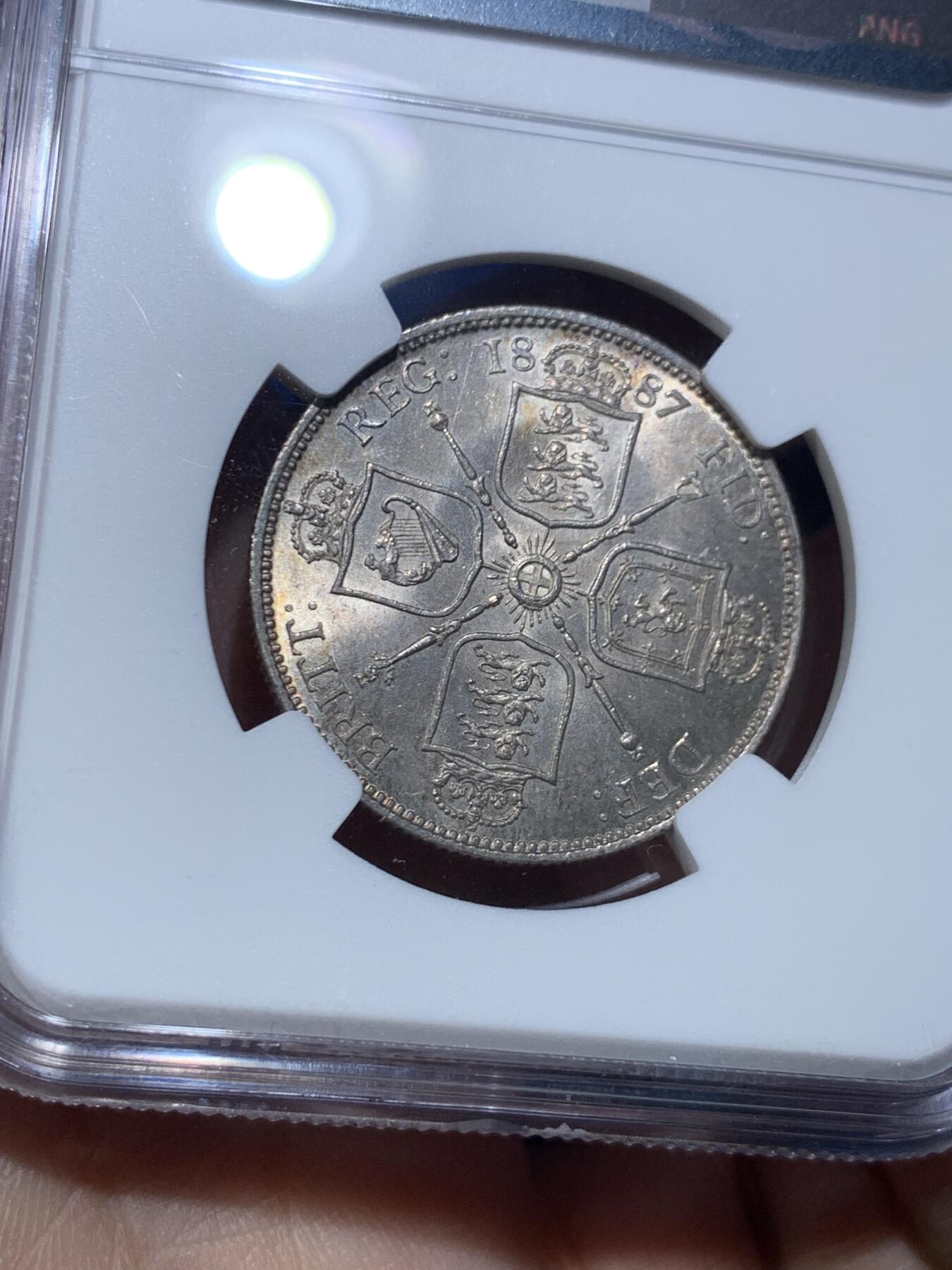 《竞宝斋》第475场 周日，周一 2场连拍 （全场包邮）欢迎送拍 NGC MS62 英国1887年高冠1弗洛林银币，淡包浆，转光不错