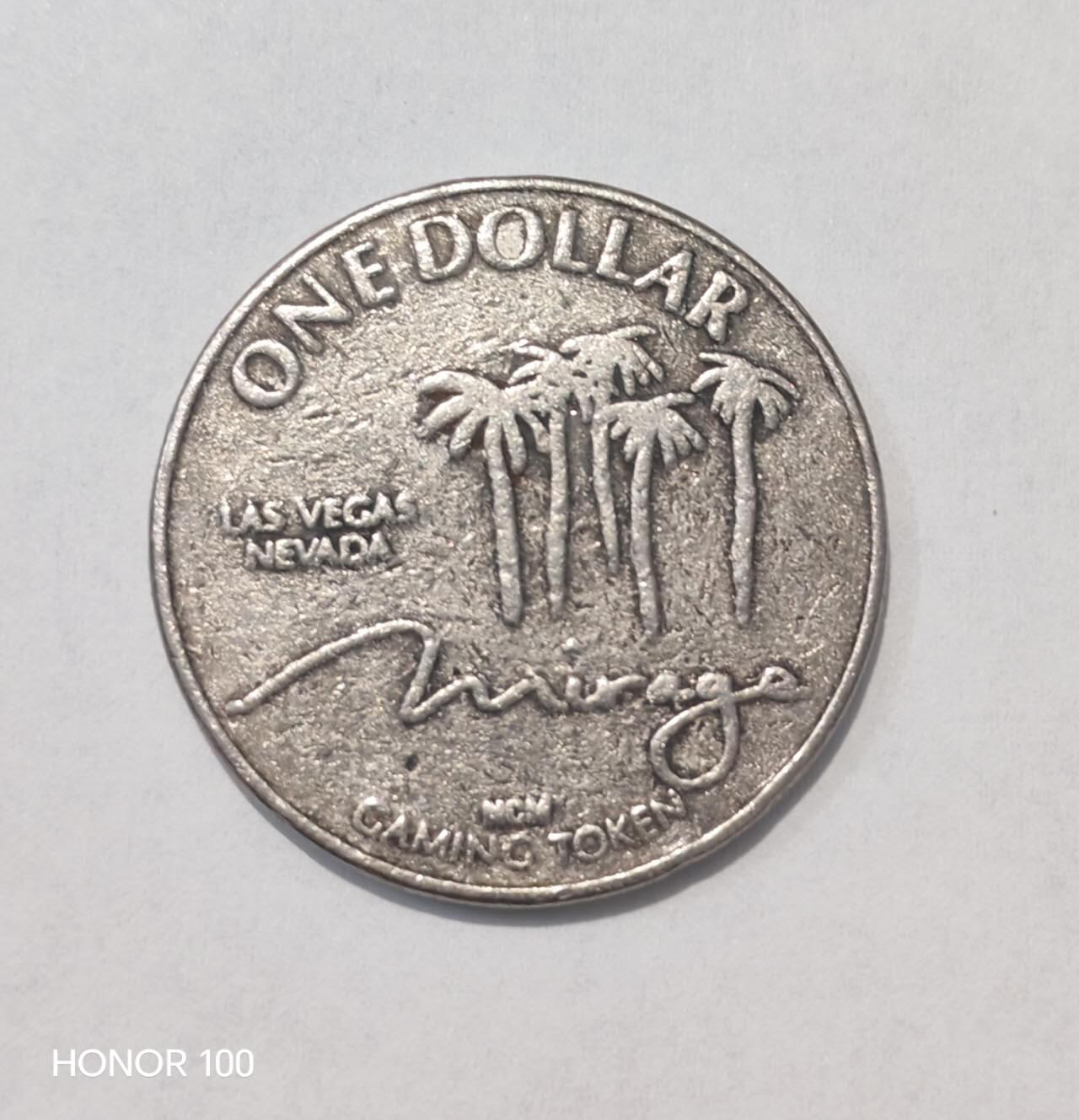 纪念章/纪念币 拉斯维加斯The Mirage赌场1美元代用币介绍   这是一枚来自美国拉斯维加斯The Mirage（幻影酒店赌场）的1美元游戏代用币（Gaming Token），属于典型的赌场专用代币，并非法定货币。- 材质多为铜镍合金（部分早期版本为银质），直径约37mm
