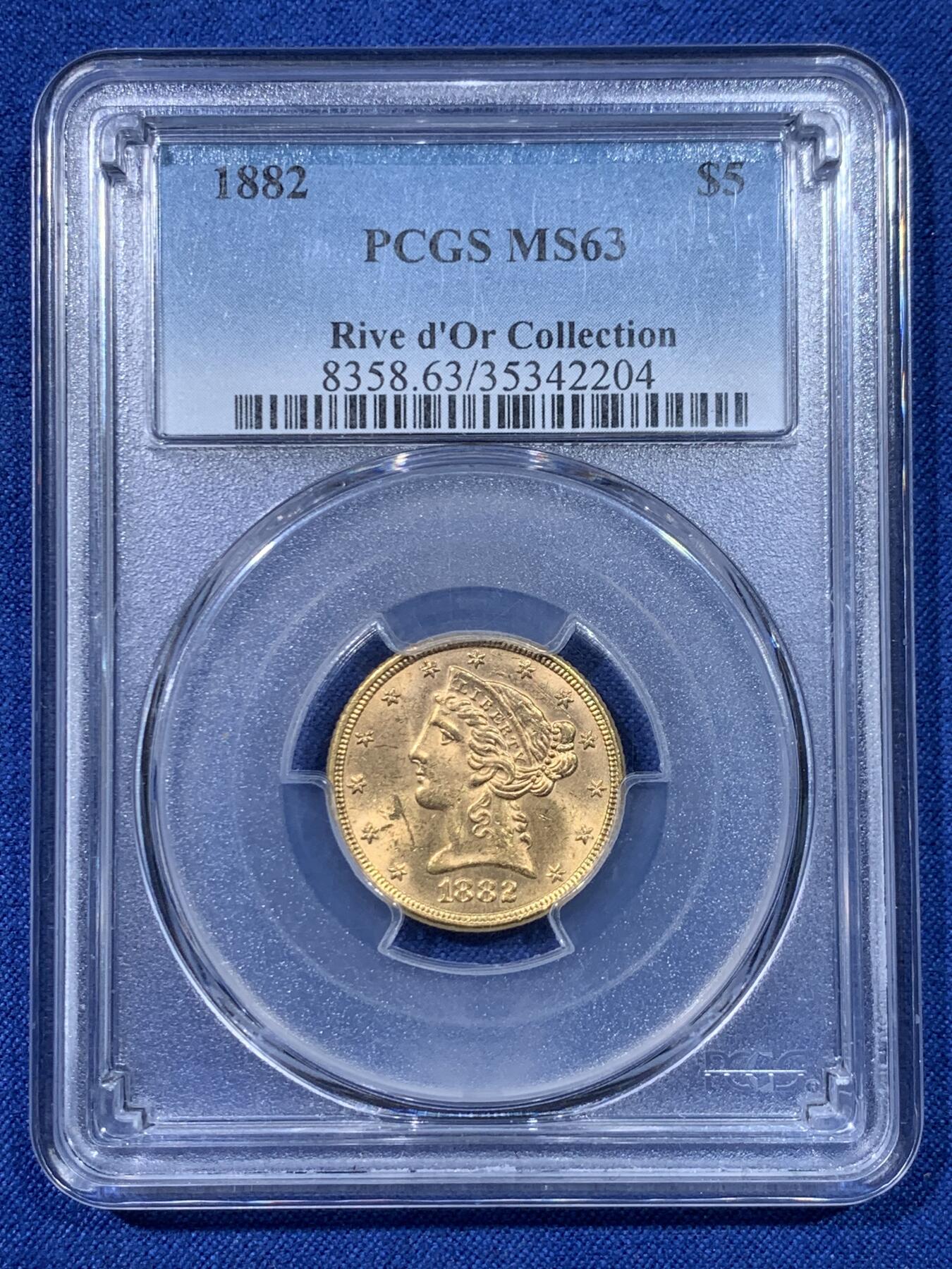 《竞宝斋》第475场 周日，周一 2场连拍 （全场包邮）欢迎送拍 PCGS MS63 美国 1882年 5美元金币 8.359g 900金 出自金河集藏 罗斯福新政中黄金法案的产物 背面支撑有磕 细节见图