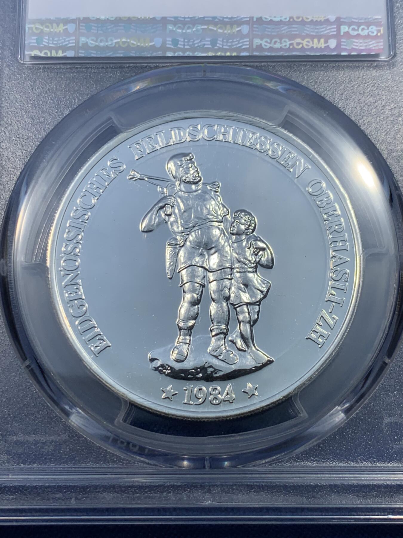 《竞宝斋》第475场 周日，周一 2场连拍 （全场包邮）欢迎送拍 PCGS MS68 瑞士1984年奥伯哈斯利射击节50法郎纪念银币，直径38毫米，重量25克，900银，发行量6000枚。类PL底板，币面清爽干净又舒适，转光强烈细节优秀，状态佳。