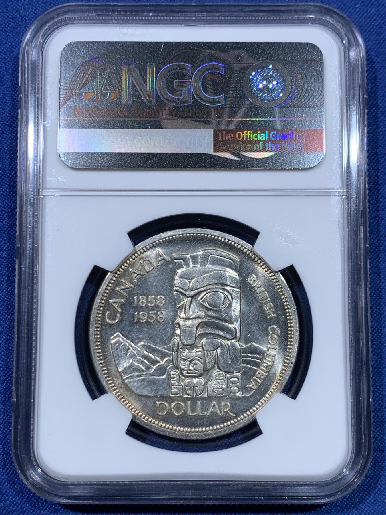 《竞宝斋》第475场 周日，周一 2场连拍 （全场包邮）欢迎送拍 NGC MS61 加拿大1958年不列颠哥伦比亚省百年纪念1元银币 伊丽莎白女王年轻头像+原住民图腾