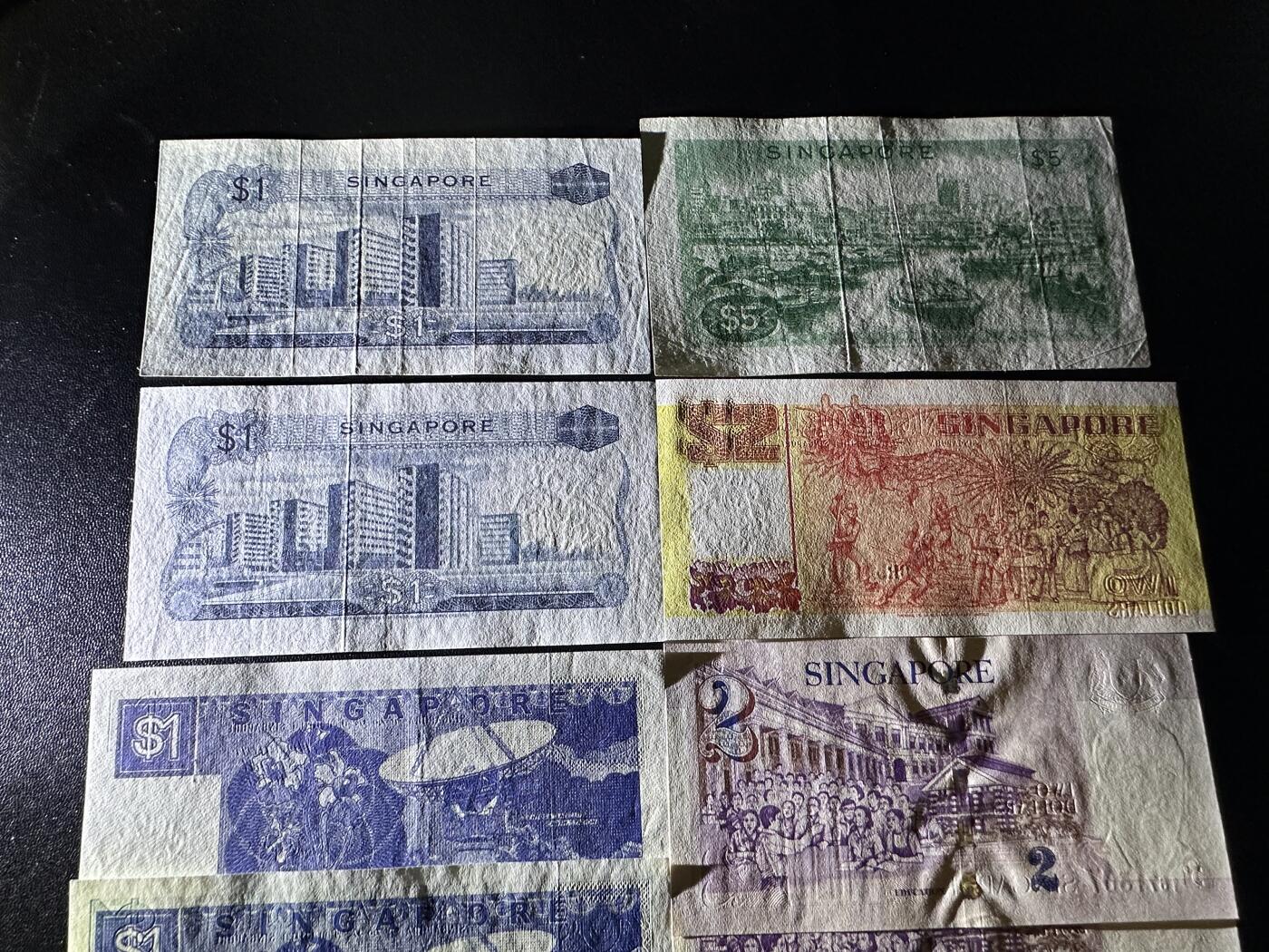 《外钞收藏家》第六百二十二期（精品场）（长期征集拍品、欢迎藏友们联系合作） 新加坡花、船、人像版 9张一起 人像有潮斑 其他非全新