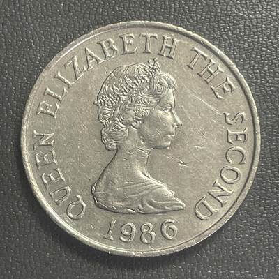 回流0406 - 英属泽西岛1986年10便士 发行量40W 泽西岛著名地质景观“魔鬼洞（Devil's Hole）”