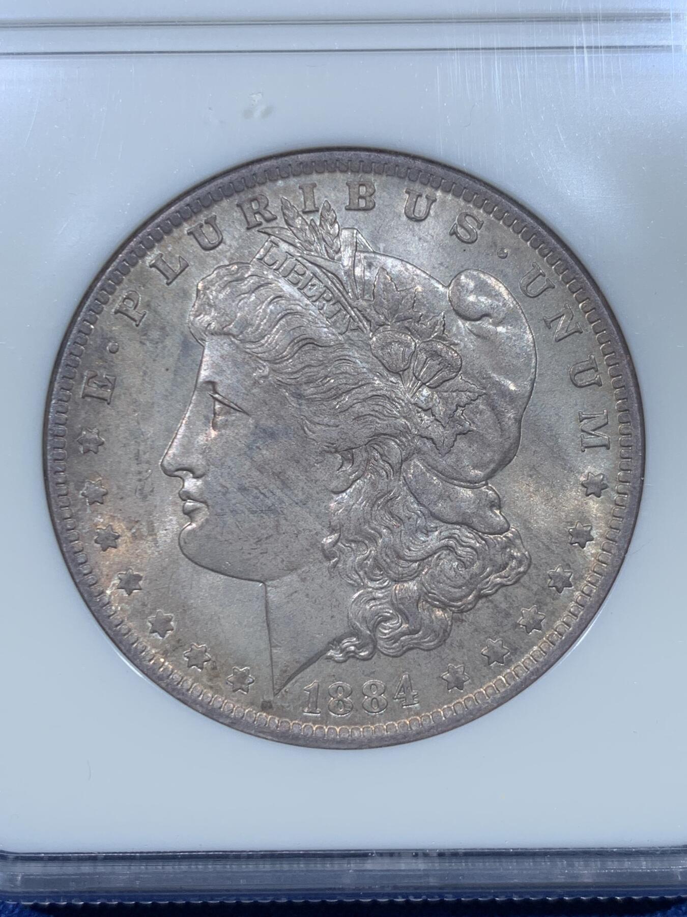 《竞宝斋》第475场 周日，周一 2场连拍 （全场包邮）欢迎送拍 NGC MS64 美国 1884年 新奥尔良厂 1美元 摩根银币 六位数编号经典老盒 双面淡五彩包浆