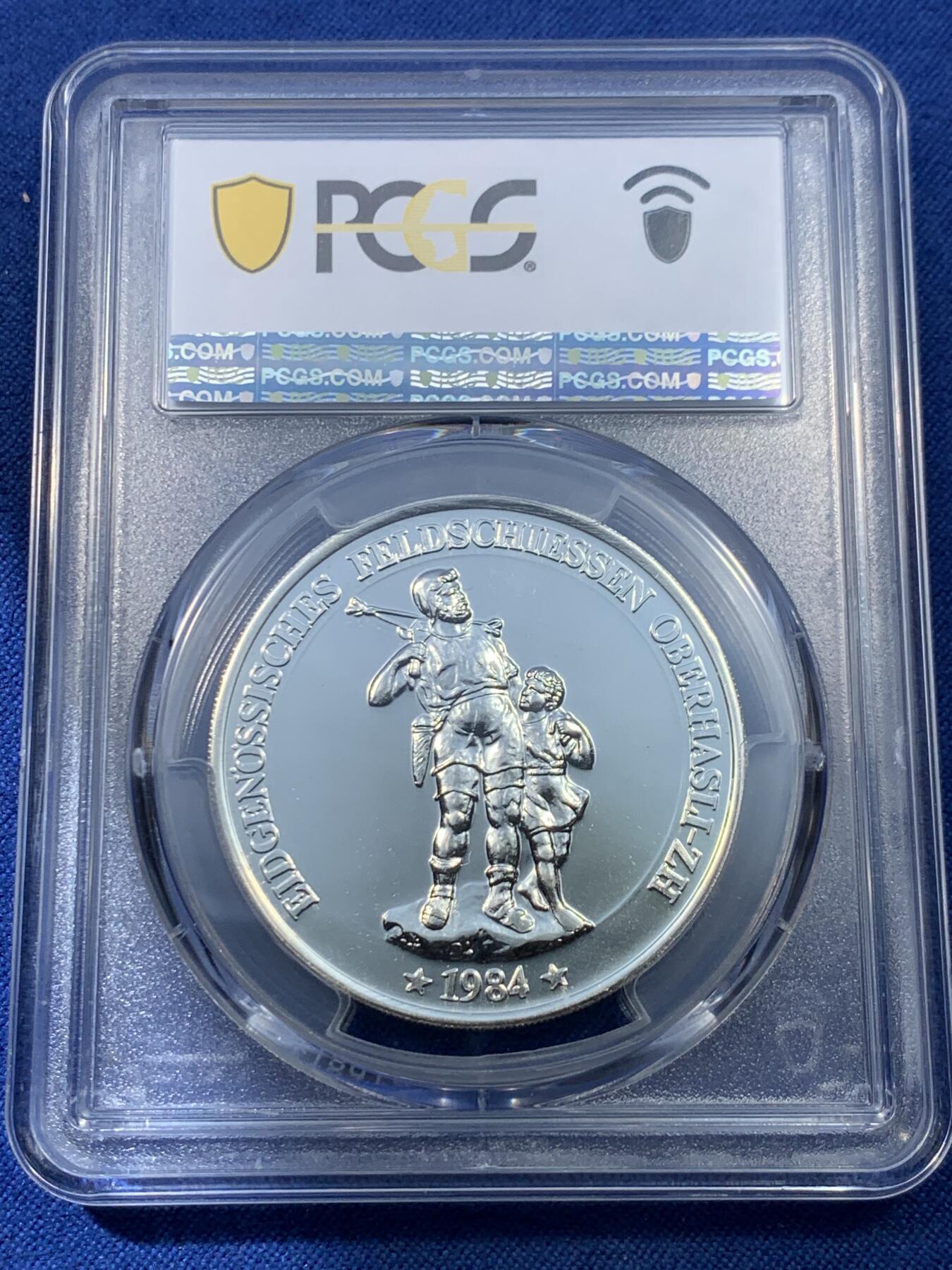 《竞宝斋》第475场 周日，周一 2场连拍 （全场包邮）欢迎送拍 PCGS MS68 瑞士1984年奥伯哈斯利射击节50法郎纪念银币，直径38毫米，重量25克，900银，发行量6000枚。类PL底板，币面清爽干净又舒适，转光强烈细节优秀，状态佳。