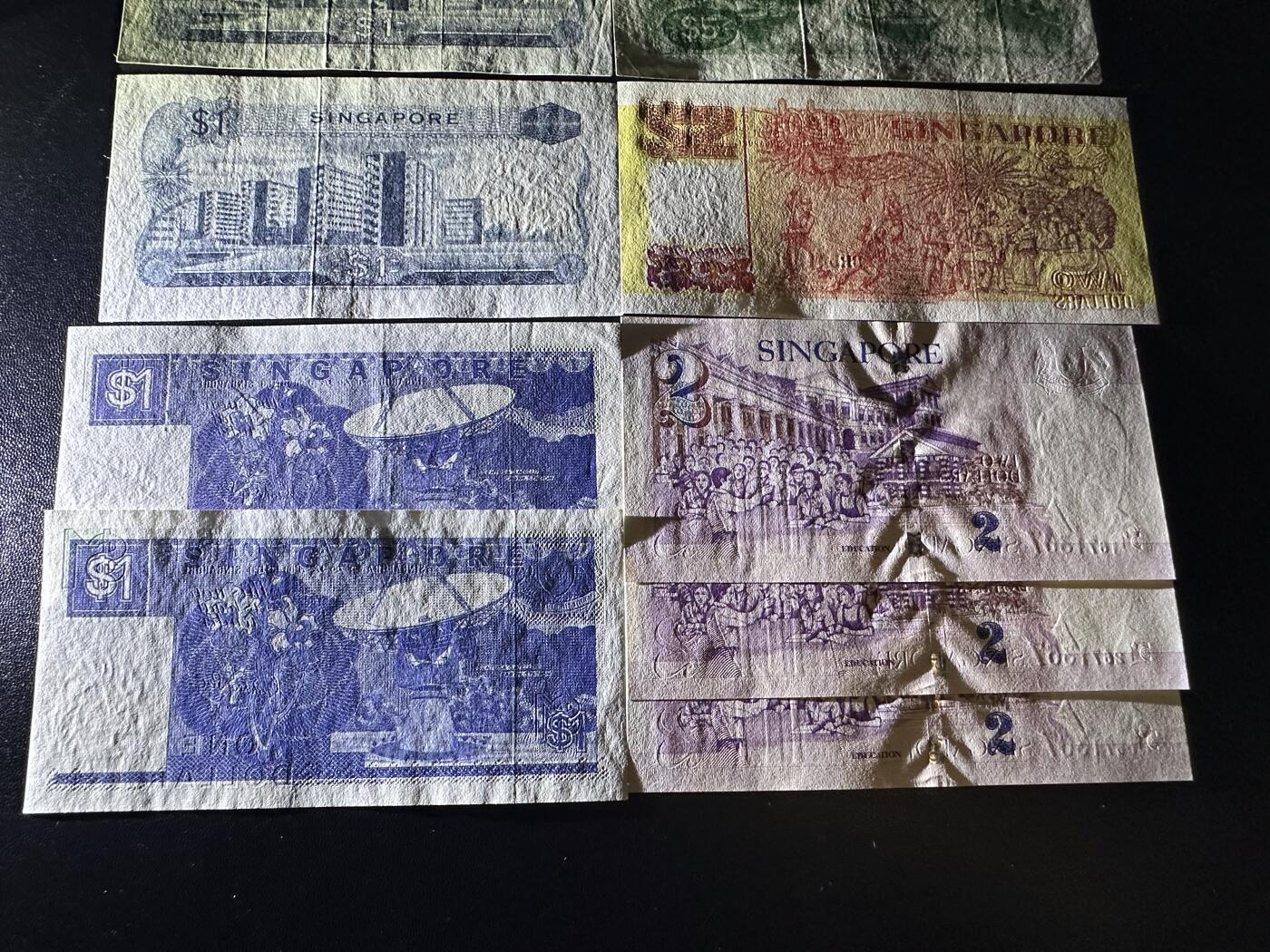 《外钞收藏家》第六百二十二期（精品场）（长期征集拍品、欢迎藏友们联系合作） 新加坡花、船、人像版 9张一起 人像有潮斑 其他非全新