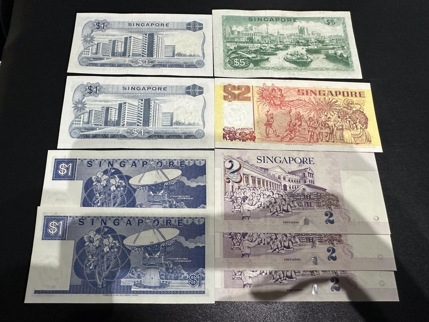 《外钞收藏家》第六百二十二期（精品场）（长期征集拍品、欢迎藏友们联系合作） 新加坡花、船、人像版 9张一起 人像有潮斑 其他非全新