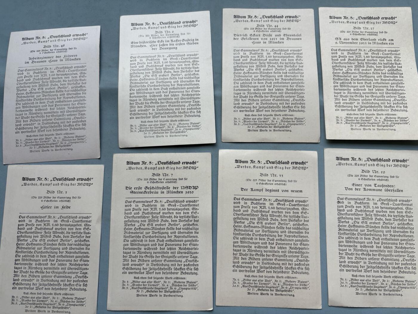 盛世勋华——号角文化勋章邮票专场拍卖第311期 1939德国烟草公司发行的政治宣传类收藏卡（Sammelbilder），属于第8册《Deutschland erwacht》（德国觉醒），核心主题是美化小胡子夺权过程。包括早期在慕尼黑、纽伦堡等地的集会与街头斗争 ，1923年啤酒馆政变、1930年国会选举等关键事件