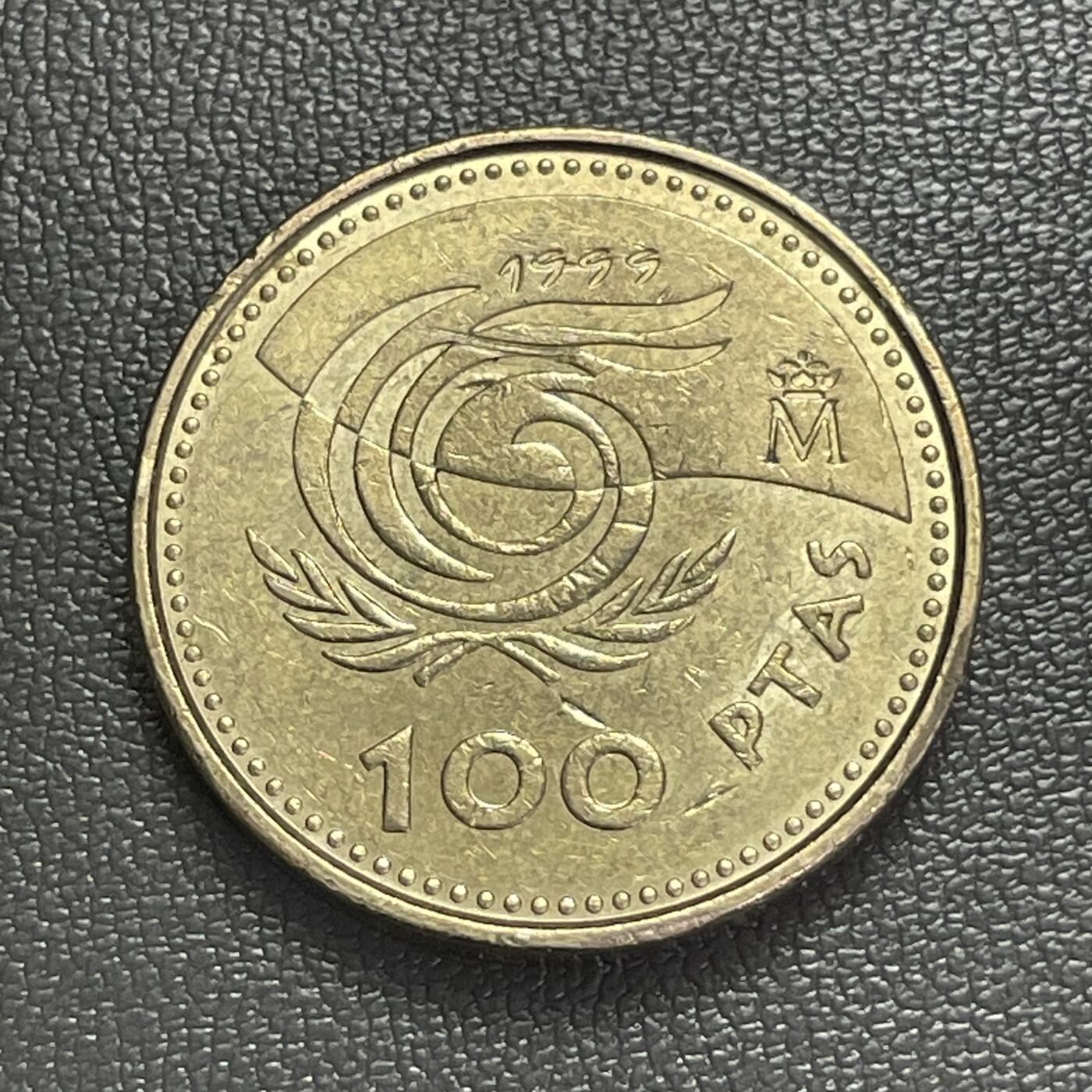 回流0406 西班牙1999年100比塞塔纪念铜币 国际老人年