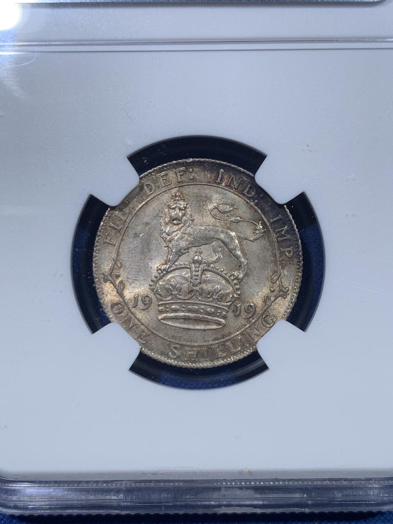 《竞宝斋》第476场 周日，周一 2场连拍 （全场包邮）欢迎送拍 NGC MS63 英国1919年乔治五世走狮1先令银币，高银版本，光度包浆一流，这个品相的1先令非常少见