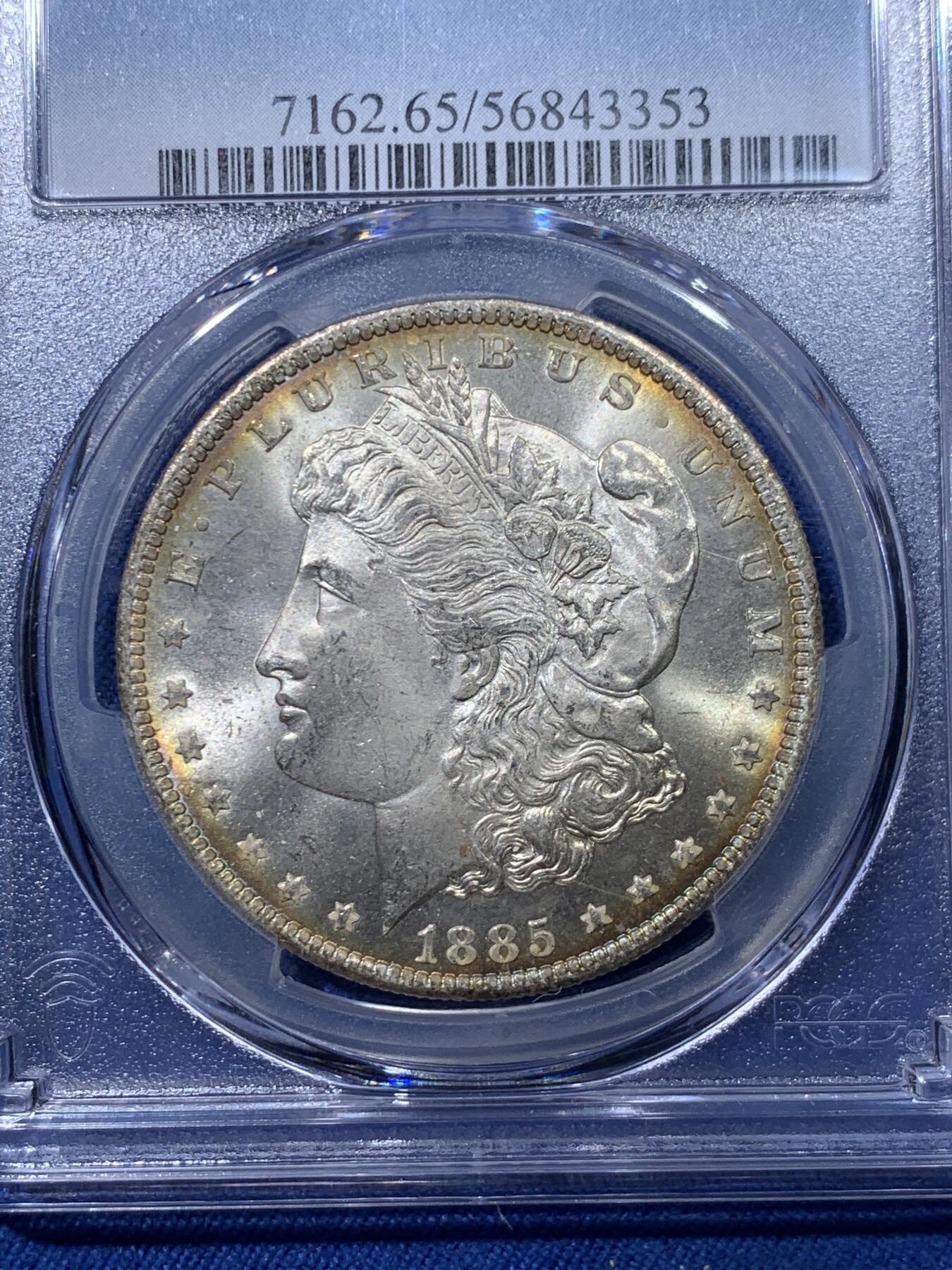 《竞宝斋》第476场 周日，周一 2场连拍 （全场包邮）欢迎送拍 PCGS MS65 美国 1885年 新奥尔良厂 1美元 摩根银币 光度非常好 边缘一圈金色包浆 很漂亮 同分中的战斗机