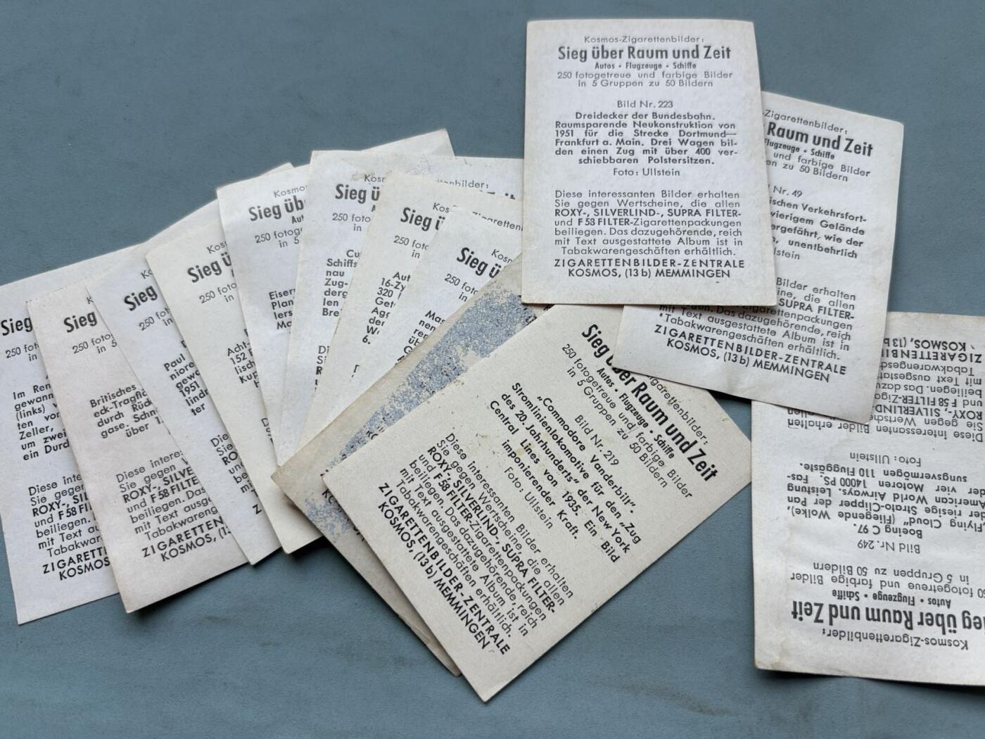 盛世勋华——号角文化勋章邮票专场拍卖第312期 1952年德国梅明根（Memmingen）的Kosmos Zigarettenbilder-Zentrale发行的香烟收藏卡一组13枚（Sammelbilder），主题为《Sieg über Raum und Zeit》（胜利跨越时空）。