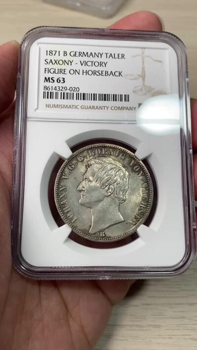 万国钱币拍卖第064期 NGC MS63 1871年德国-萨克森普法战争胜利泰勒 胜利系列中难度最大品种 经典骑马女武神凯旋 原味香槟色转光环彩收藏级品质