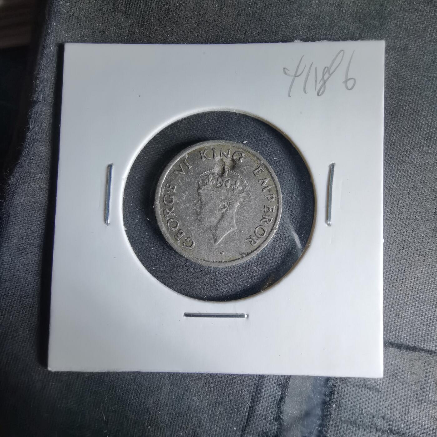 沼泽如烟--第1041场 英属东印度1946年四分之一卢比有伤