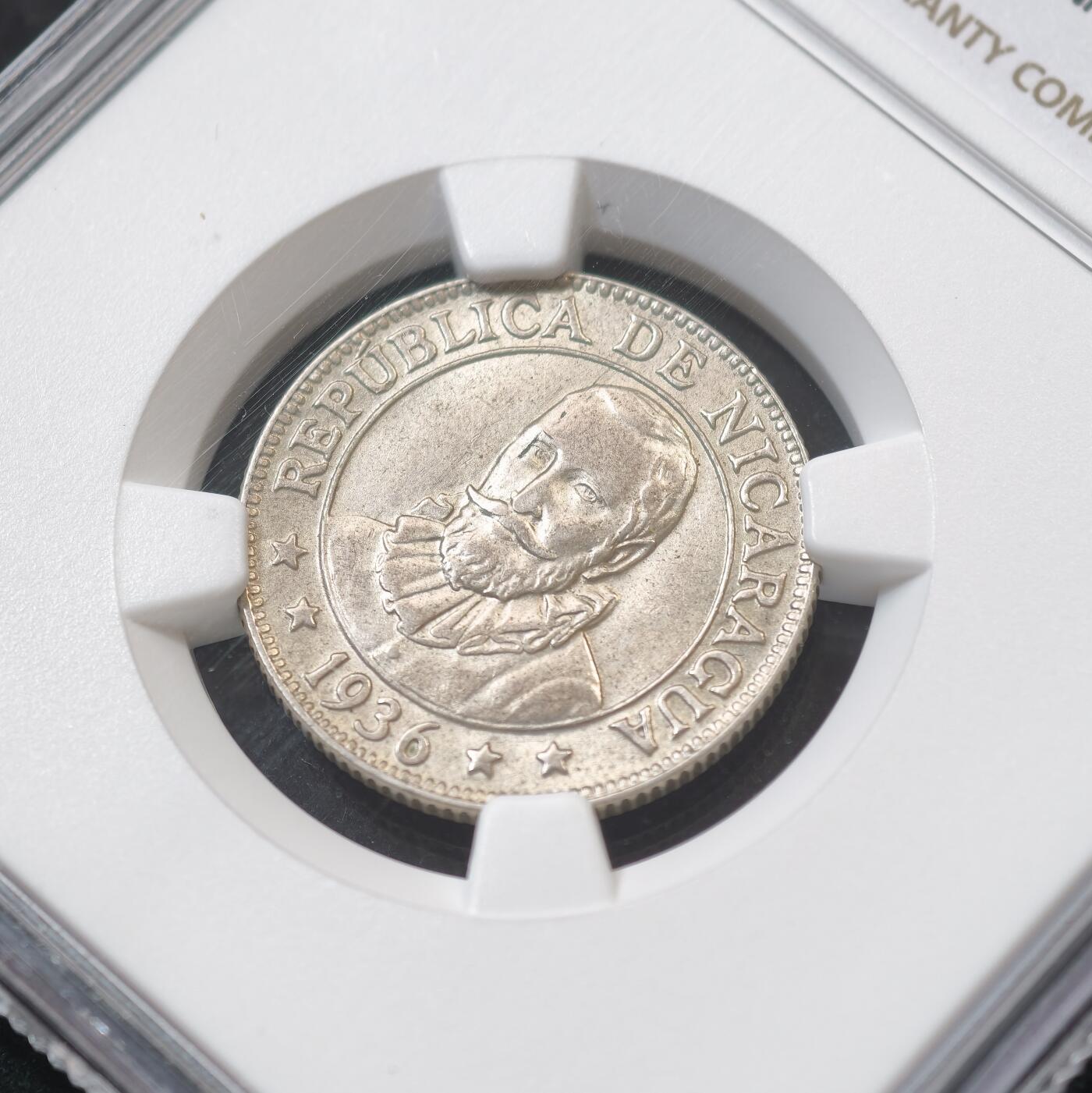 甄臻铺-世界币章拍卖（第58期），送拍享返佣金等优惠多多 NGC-MS64 尼加拉瓜1936年特年25分银币 NGC冠军分 2026年1月麦稀奇拍卖同款普年MS64分成交价1200元，尼加拉瓜最后一套银本位货币，美国费城造币厂代铸，总铸造量仅10万枚，拉美老银币是国际收藏圈公认的价值洼地，投资收藏皆宜。