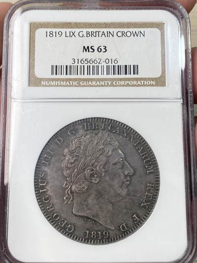 万国钱币拍卖第064期 - NGC MS63 1819LIX英国乔治三世马剑克朗 英国马剑系列开山之作 均匀厚重的英式天鹅绒乌云五彩全覆盖 全深打高浮雕轻微类镜面质感 同分中罕见的顶级状态 NGC老盒典藏级品质