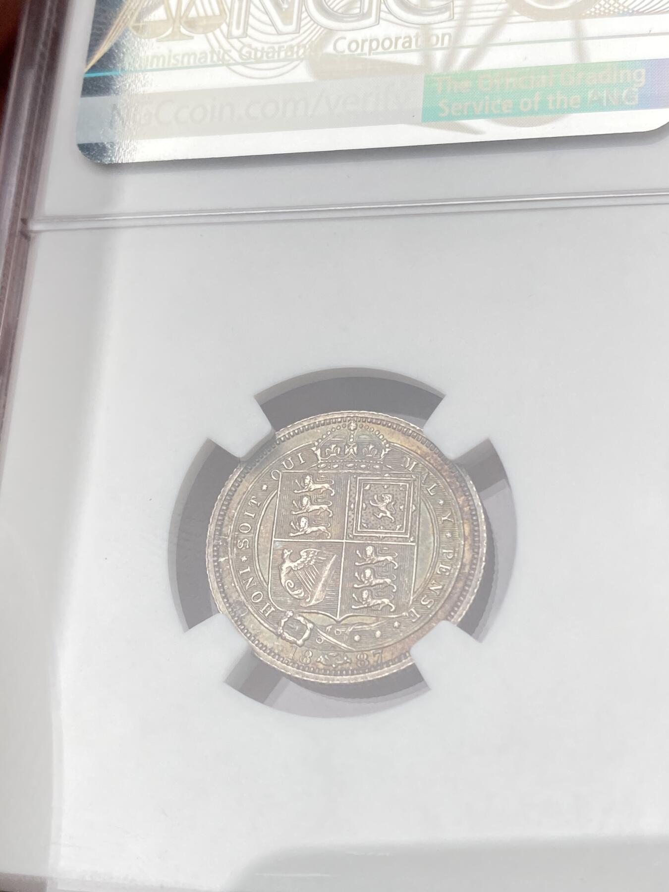万国钱币拍卖第064期 NGC MS65 1887年英国维多利亚女皇高冠盾徽6便士银币盾徽版 厚重英式天鹅绒孔雀绿五彩 全深打顶级BU状态