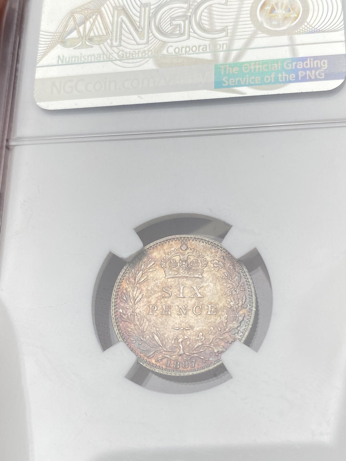 万国钱币拍卖第064期 NGC MS65 1887英国维多利亚女皇高冠6便士银币面值版 华丽英式天鹅绒五彩也难掩其底光迸发 小中见大的顶级BU状态 典藏级品质